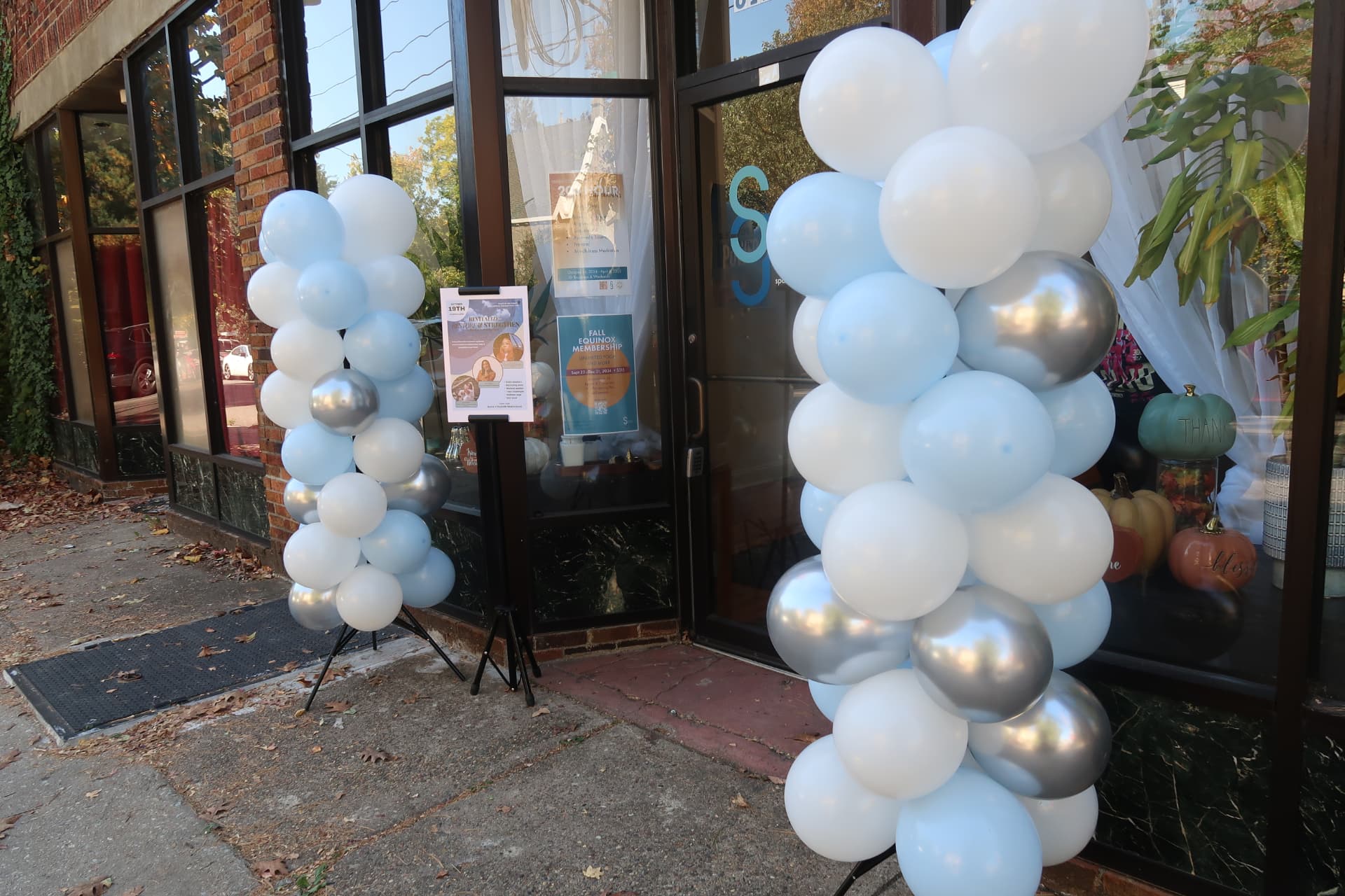 Entrance to Revitalize: Restore & Strengthen with blue, white, and silver balloons