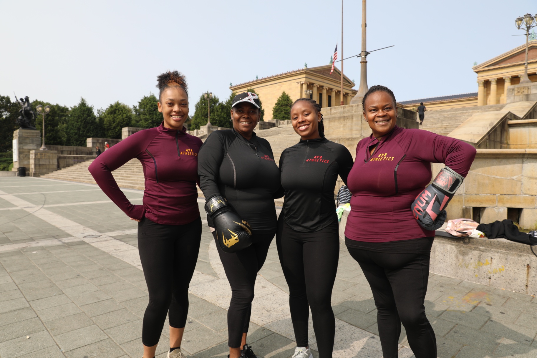 Four women gathered for an outdoor training session