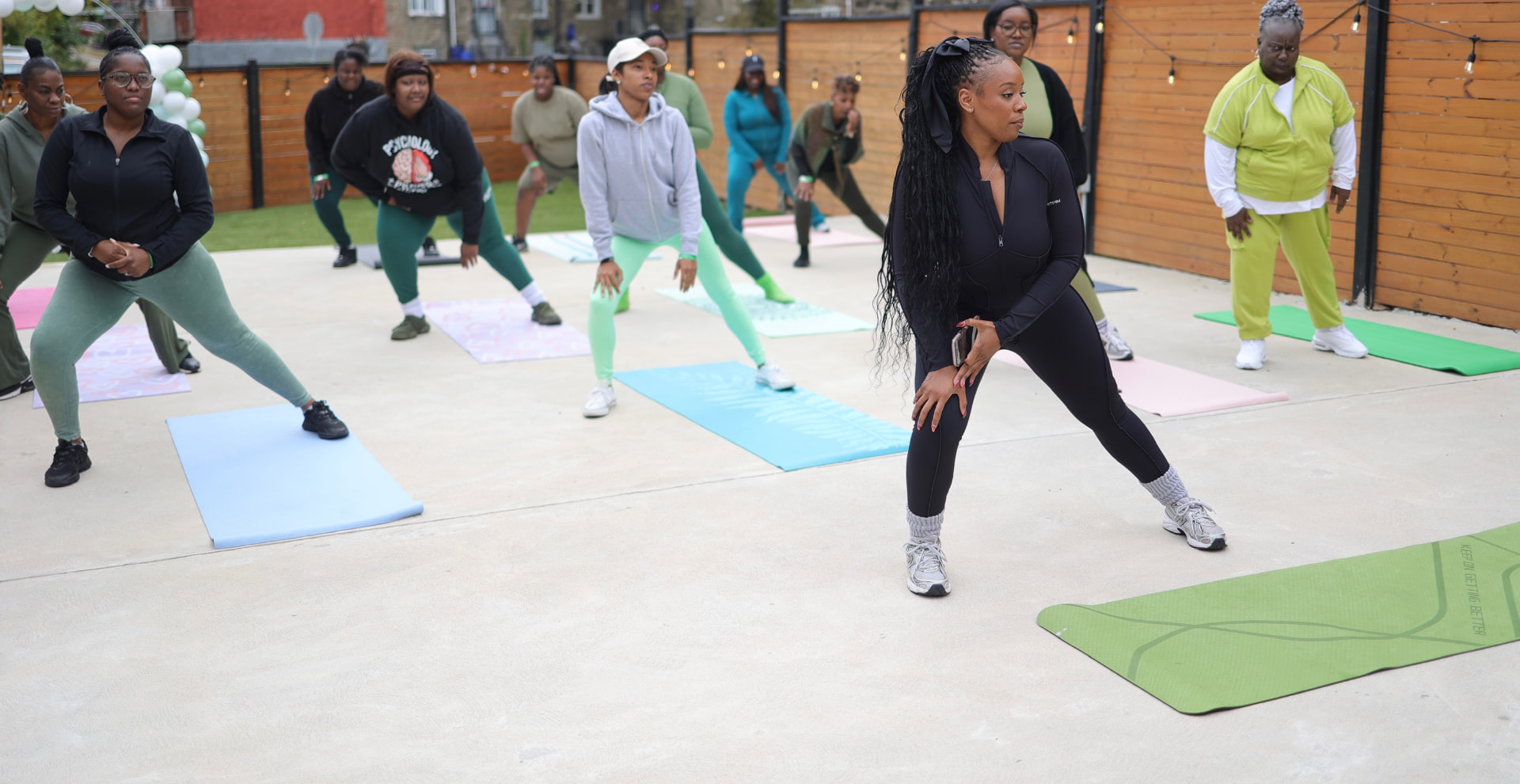 Group side-lunge workout led by Ayreeona Burrows at the 2025 experience