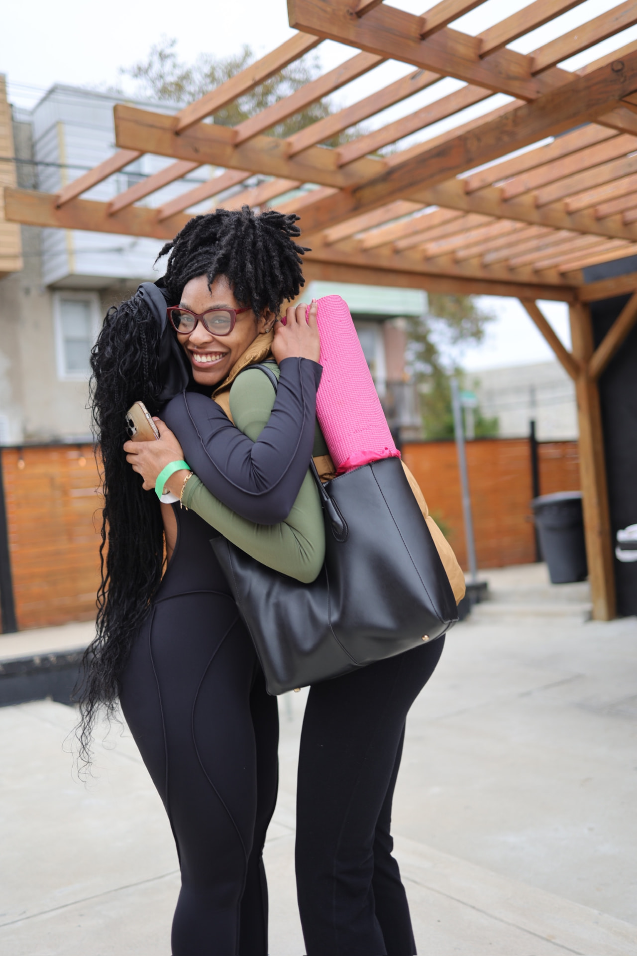 Two attendees embracing at the 2025 AyrFitWomen experience