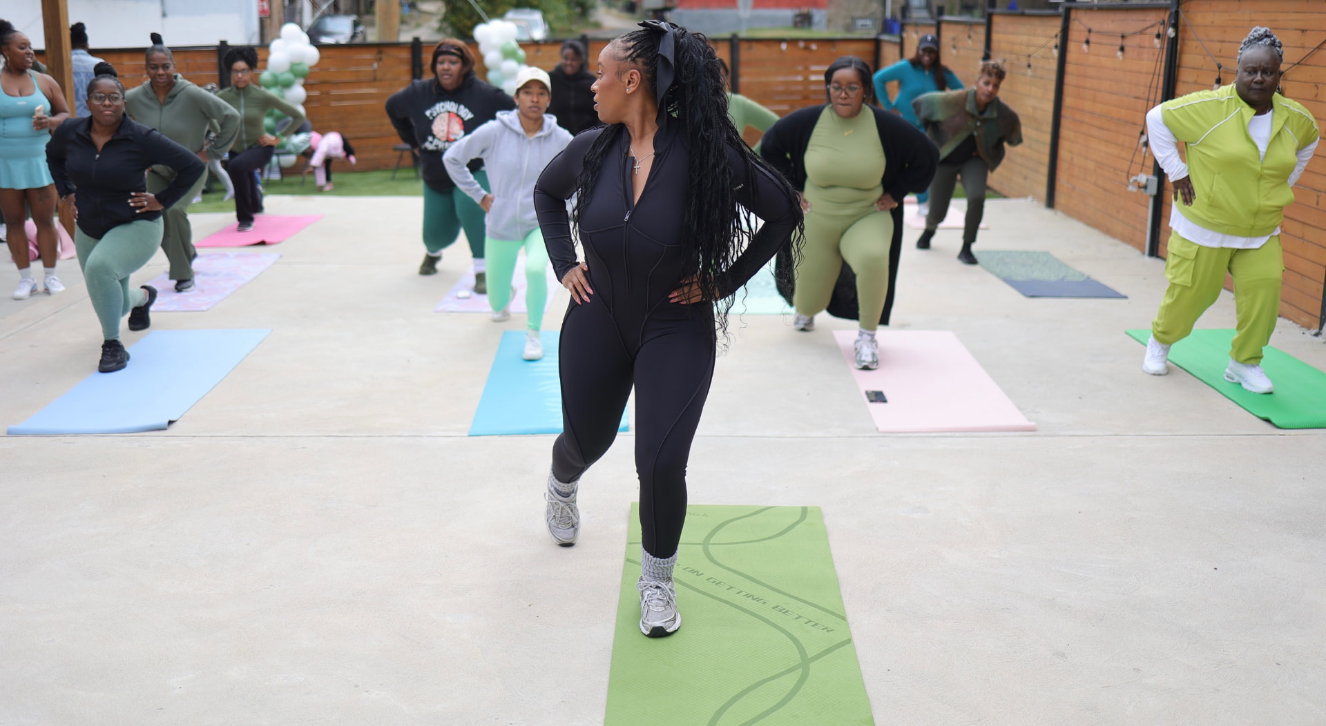 Attendees in a guided workout at the 2025 AyrFitWomen experience