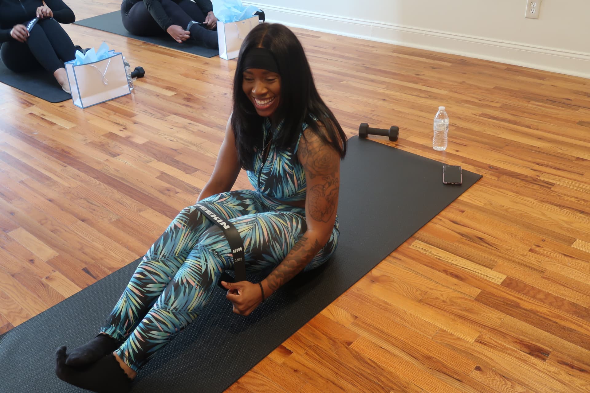 Attendee smiling during the guided fitness experience at Revitalize 2024